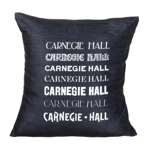 Black plush throw pillow with seven white Carnegie Hall historical logos on the front.