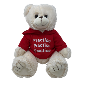 A white plush teddy bear wearing a red hooded sweatshirt. 