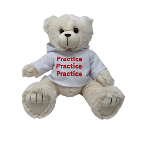 A white plush teddy bear wearing a white hooded sweatshirt. 